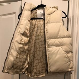 Cream colored puffy vest with hood